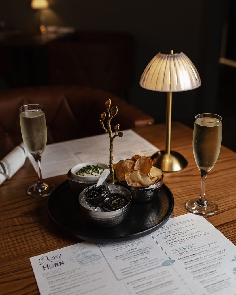 Caviar & Chips Table set with Caviar & Chips and glasses of champagne