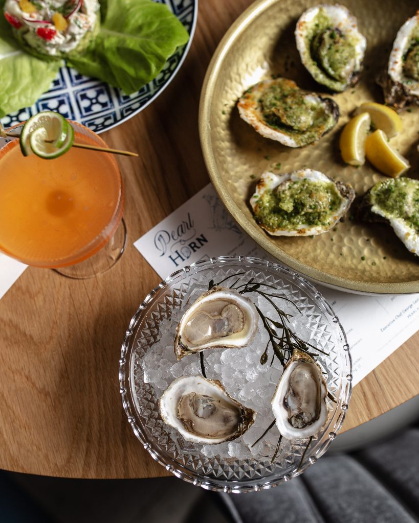 Oyster Bar Plate of oysters served with garnishes